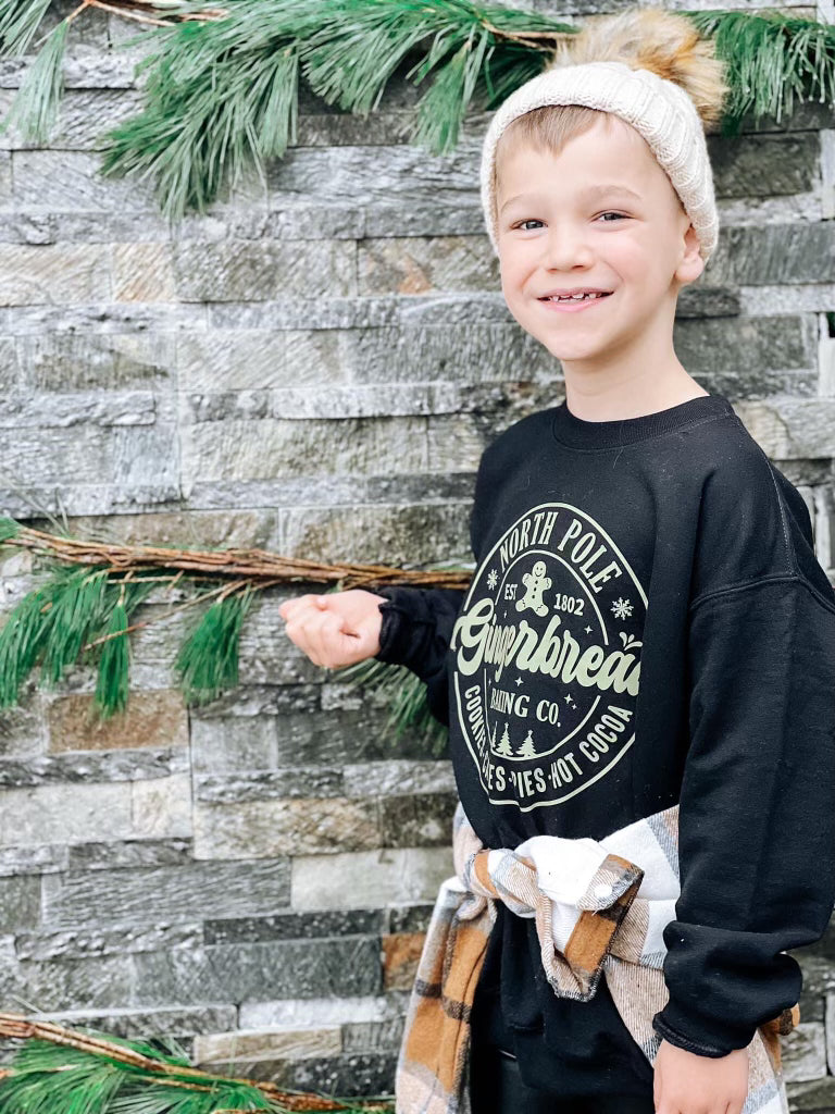 North Pole gingerbread baking co( black sweatshirt)