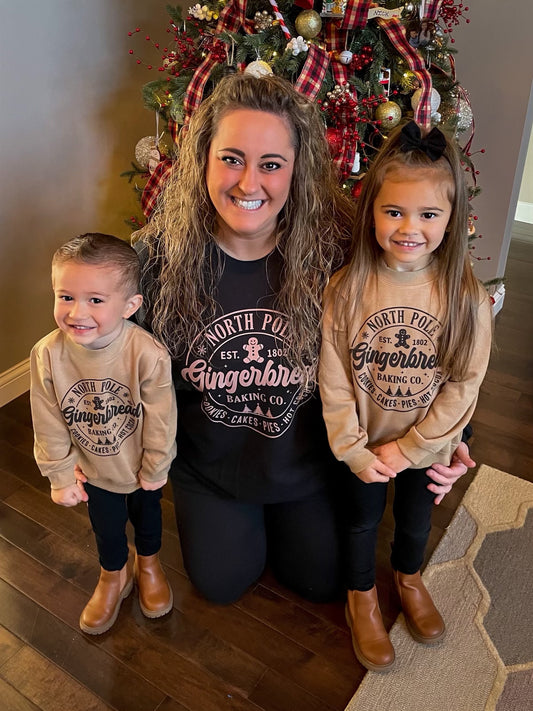 North Pole gingerbread baking co( black sweatshirt)